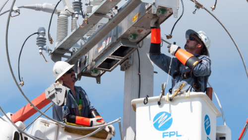 An IntelliRupter fault interrupter being installed.