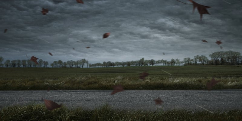 storm over a parking lot and grassy field storm over a parking lot and grassy field