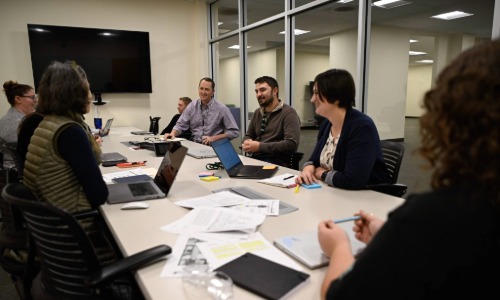 group discussing at a conference table