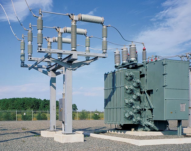 A close up image of a Series 2000 Circuit-Switcher in a lineup that shows a transformer on the left side of the circuit switch in a substation Series 2000, Circuit Switcher, Substation, fault interrupting, transformer switching, protection